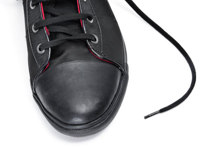 closeup of a black sneaker isolated on a white background