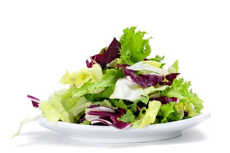 a plate with lettuce mix isolated on a white backgroundの写真素材