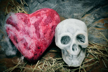 a skull and a heart on a scary background for Halloweenの写真素材