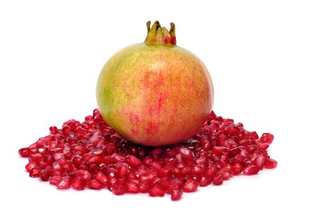 a pomegranate fruit and arils isolated on a white backgroundの写真素材
