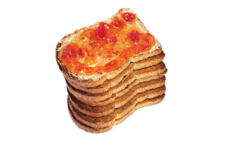 bread rusk with butter and jam isolated on a white backgroundの写真素材