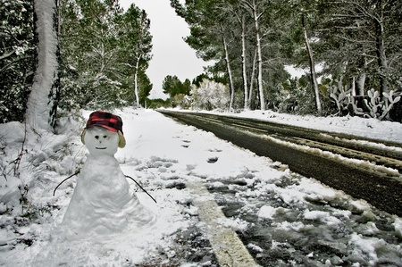 snowman in a snowy landscape, a beautiful winter sceneの写真素材