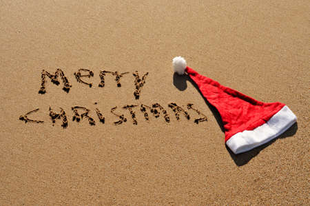 sentence merry christmas written in the sandの写真素材