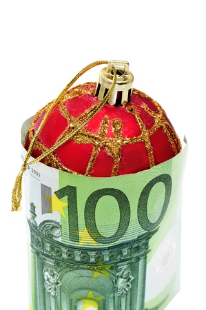 a christmas ball with euro bills symbolizing cosumerismの写真素材