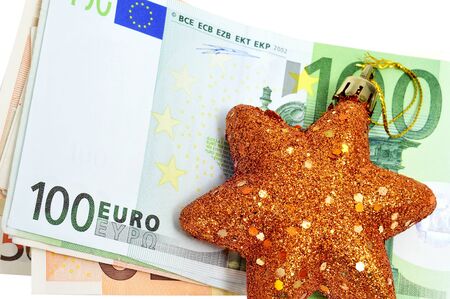 a christmas star with euro bills symbolizing cosumerismの写真素材