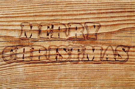 merry christmas written in an old wooden boardの写真素材