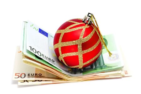 a christmas ball with euro bills symbolizing consumerismの写真素材