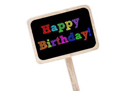 happy birthday written in different colors in a blackboard labelの写真素材
