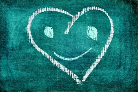 a funny heart drawn in a blackboardの写真素材