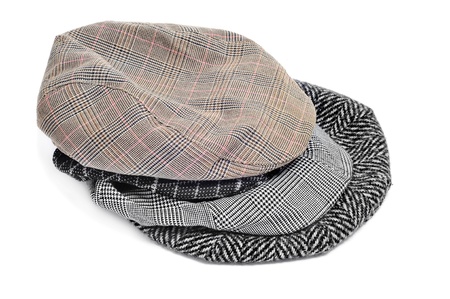 some flat caps and bonnets isolated on a white backgroundの写真素材