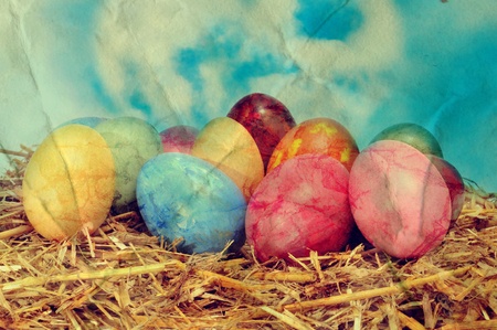 a vintage picture of some easter eggs on a nestの写真素材
