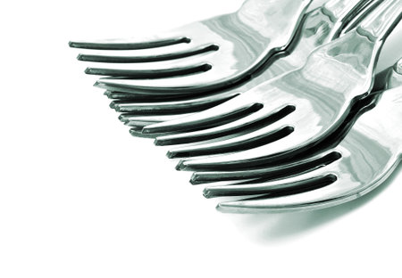 closeup of some forks on a white background