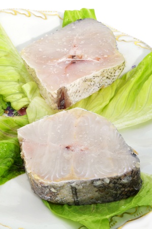 closeup of some hake slices on a plateの写真素材