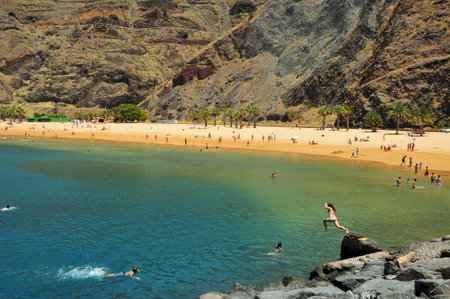 Tenerife, Spain - June 23, 2011: A view of Teresitas Beach in Tenerife, Canary Islands, Spain. This is the nearest beach to Santa Cruz, capital of Tenerife, and one of the few in the North-East of the islandのeditorial素材