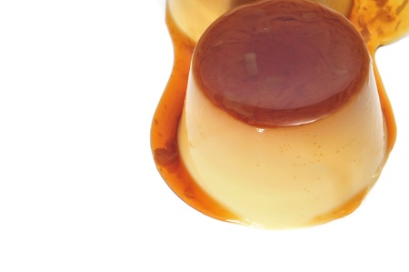 a creme caramel on a white backgroundの写真素材
