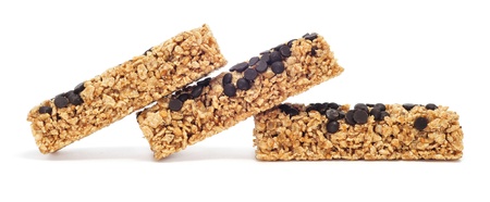some cereal bars with chocolate chips on a white backgroundの写真素材