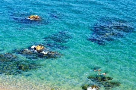 someone diving in a tropical blue beachの写真素材