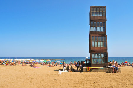 Barcelona, Spain - August 16, 2011: Barceloneta Beach in Barcelona, Spain. The sculpture designed by installation artist Rebecca Horn in COR-TEN steel presides over this urban beachのeditorial素材