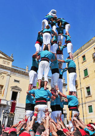 Tarragona, Spain - September 23, 2011: Castells in Tarragona, Spain. Every September 23, Santa Tecla holiday, those typical catalan human towers are performed in Plaza de la Fontのeditorial素材