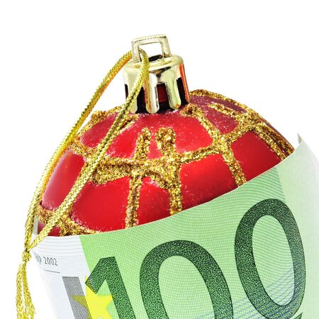 a christmas ball with euro bill symbolizing consumerismの写真素材