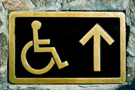a disabled access sign on a signboard