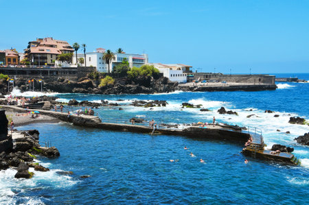 Puerto de la Cruz, Spain - June 15, 2011: San Telmo Beach and baths in Puerto de la Cruz, Spain. Locals enjoy this beach and these baths during most of the yearのeditorial素材