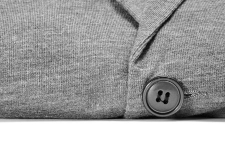 closeup of a gray cardigan on a white background