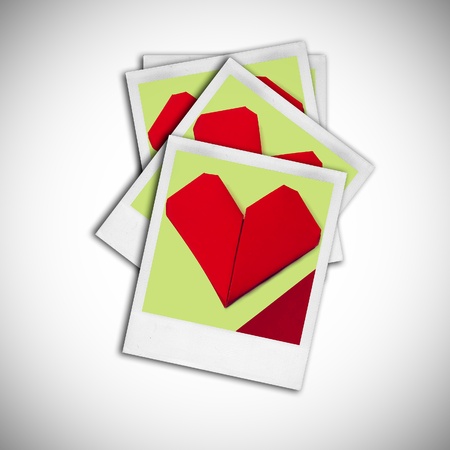 instant pictures of paper hearts on a white backgroundの写真素材