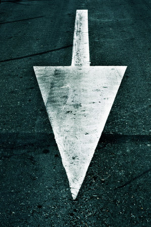 an arrow painted on the road