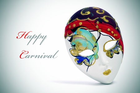a venetian carnival mask and the sentence happy carnivalの写真素材