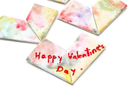 some paper hearts of different colors and the sentence happy valentines day written in one of themの写真素材