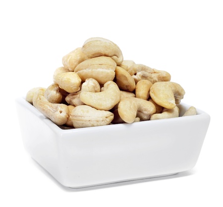 a bowl with cashews in a white backgroundの写真素材