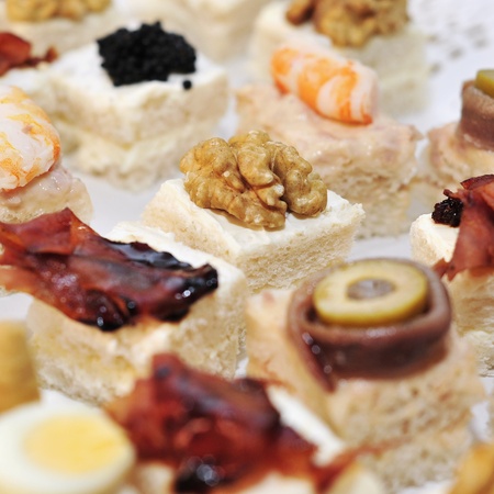 closeup of a pile of different canapesの写真素材