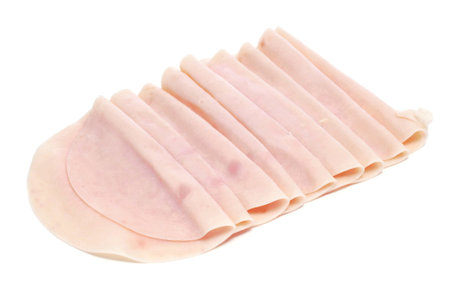 some slices of turkey ham on a white backgroundの写真素材