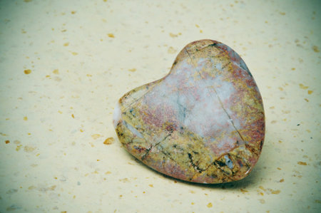 heart-shaped stone on a marbled background