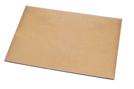 a blank brown envelope on a white backgroundの写真素材