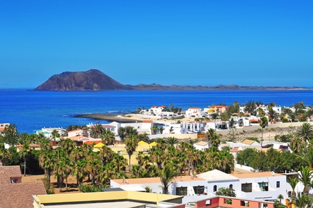 a view of Lobos Island from Corralejo in Fuerteventura, Canary Islands, Spainの写真素材