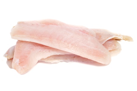 closeup of some raw hake slices on a white backgroundの写真素材