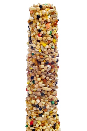 closeup of a birdseed bar on a white backgroundの写真素材