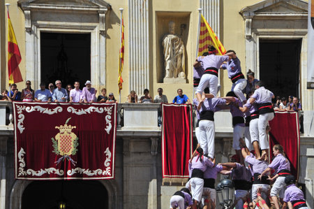 Tarragona, Spain - September 16, 2012: Castells in Tarragona, Spain. Every year, during Santa Tecla festival, those typical catalan human towers are performed in Plaza de la Fontのeditorial素材