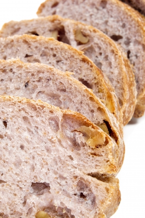 some slices of walnuts bread on a white backgroundの写真素材