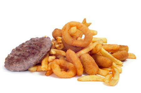 closeup of a tray with fried and fattening food on a white backgroundの写真素材