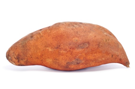 a raw sweet potato on a white backgroundの写真素材