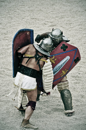 Tarragona, Spain - May 26, 2012: Gladiators on the arena of Roman Amphitheater in Tarragona, Spain. Every year, the historic recreation program TarracoViva recreates a gladiators fightのeditorial素材