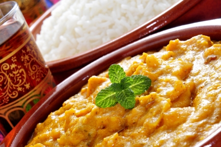 closeup of some bowls with korma curry and basmati riceの写真素材