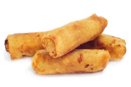 closeup of some spring rolls on a white background
