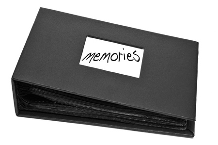 a photo album with the word memories written on it on a white backgroundの写真素材