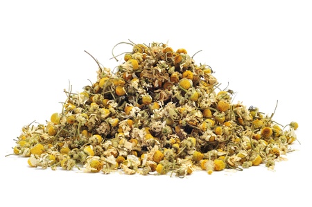 a pile of dried chamomile flowers on a white backgroundの写真素材