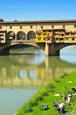 Florence, Italy - April 15, 2013: Ponte Vecchio and Arno River in Florence, Italy. This medieval bridge is one of the most visited landmarks in Florence and the most picturesqueのeditorial素材