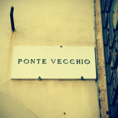 picture of a marbled plaque with the name Ponte Vecchio written in it in Florence, Italy, with a retro effectの写真素材